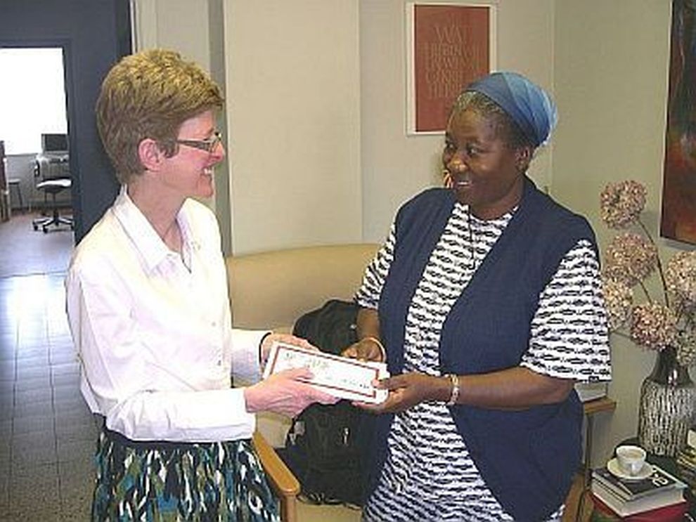 Mary Hands the Cheque to Sister Euphrasie