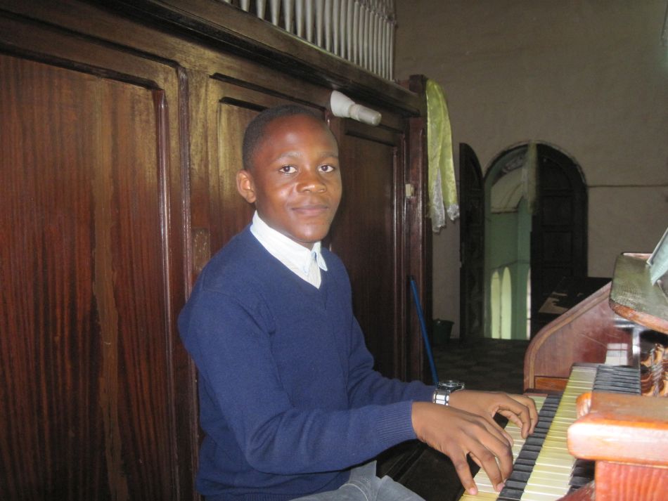Boy playing organ at cathedral Boy playing organ at cathedral
